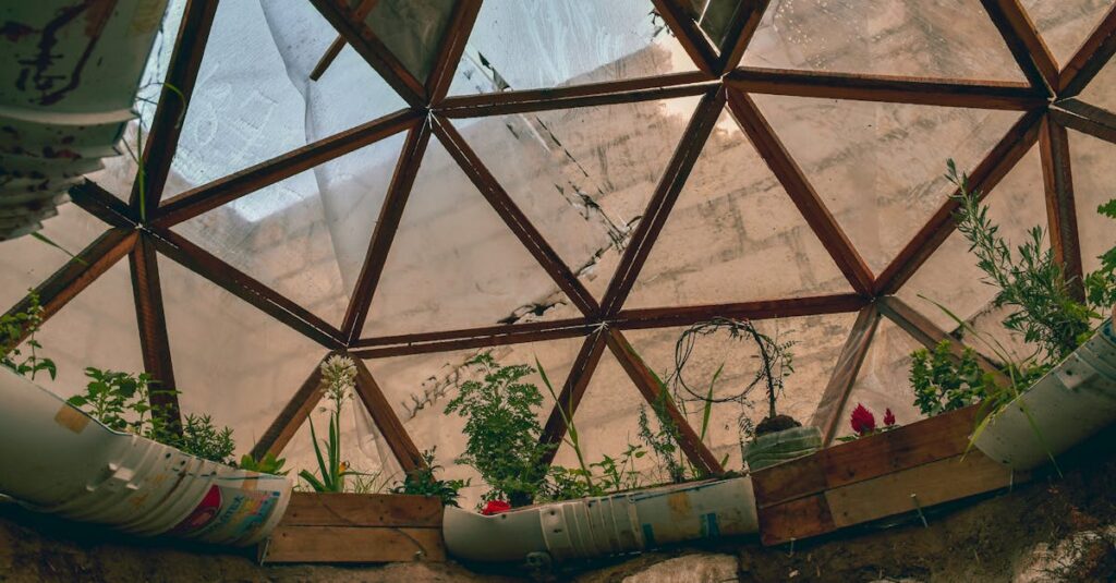 Geodesic dome interior with vibrant plants and flowers in urban garden setting.